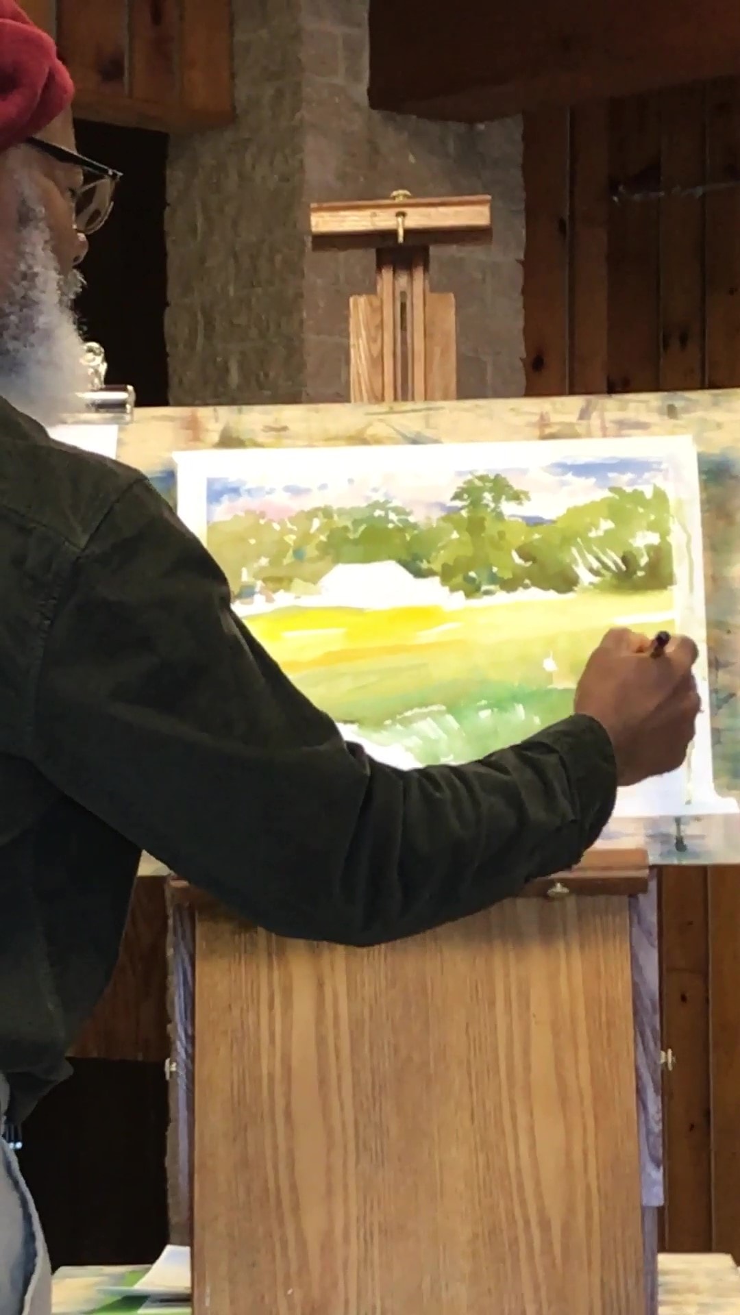 Dwight Rose painting a landscape scene